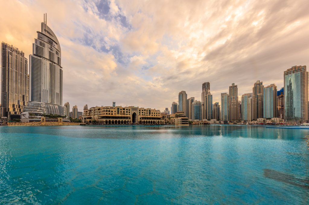 Dubai Marina canal and promenade. Cityscape with beautiful contemporary skyscrapers and bay.